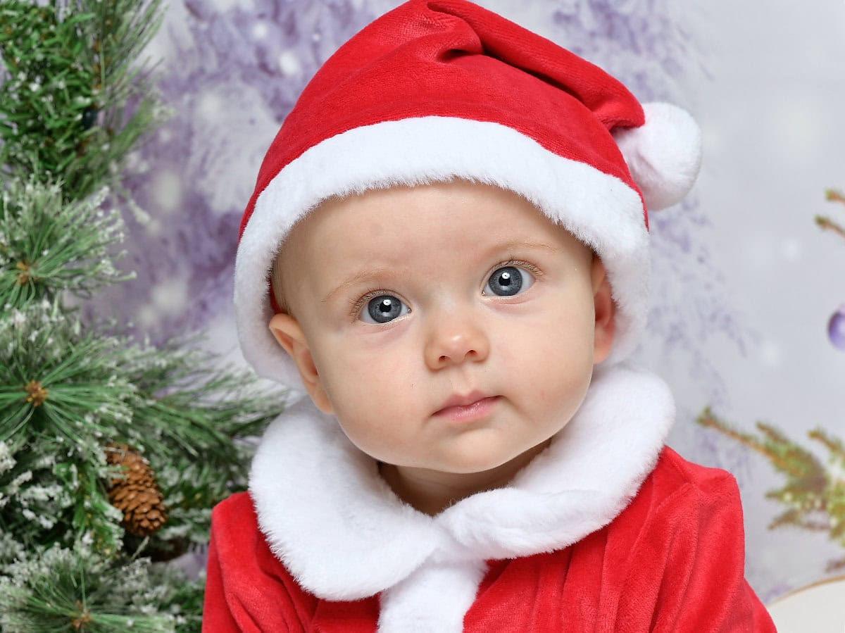 Photo of a baby dressed as Father Christmas